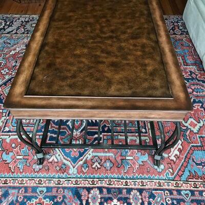 coffee table with leather top and wrought iron shelf $165
48 X 28 X 18 1/2