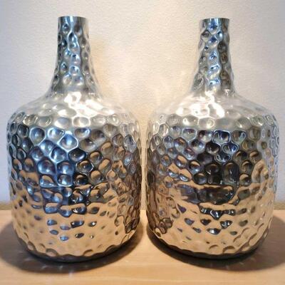 3064	

2 Silver Decorative Vases
Measures Approx 21"x20"