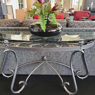 2018	

2 Glass Top Entry Way Tables with Vases
Tables measures approx 52" x 18" x 28"