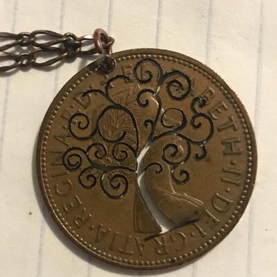 Laser tree of life cut coin