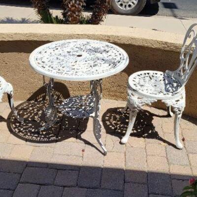 Iron chairs and small table
