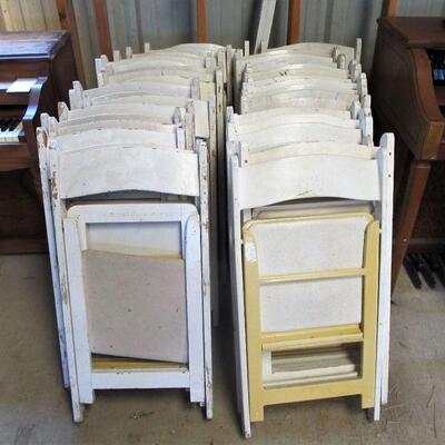 Large collection of white event chairs
