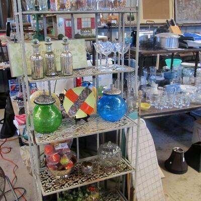 Nice folding metal bakers rack.  lots of lovely glassware & dishware.