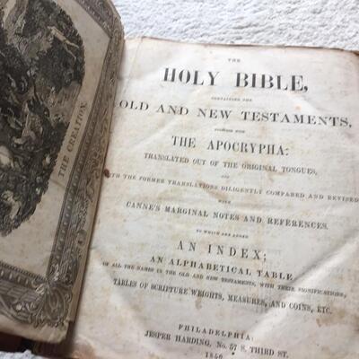 Civil War 1850 Bible, named to a soldier who died in 1863. Glued onto the inside of the front cover is a newspaper clipping from the war,...