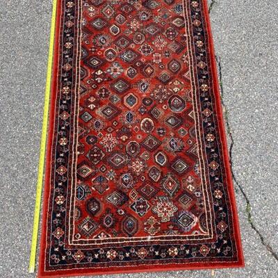 Ruby and copper colored wool rug