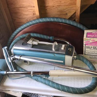 Two  working Electrolux canister vacuums - Each with hoses and brush accessories