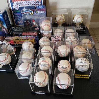 Quite a collection of baseballs, most are autographed, eve a Yogi Berra ball, Terry Collins, Mets manager, to name a few