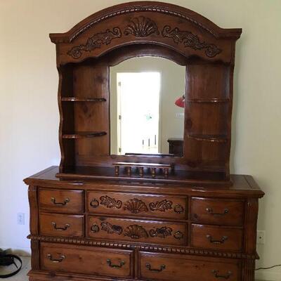 large dresser with mirror in master bedroom