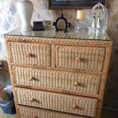 Wicker dresser with three large drawers and two small. 