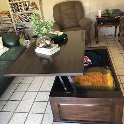 Lift top coffee table with hidden storage. Great for enjoying a meal in front of the TV and for storing blankets, pillows and more. Two...