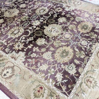 Beautiful lazy boy area rug. Colors are purple and tan, approximately 6x9