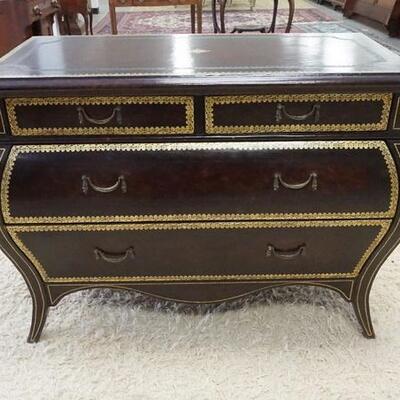1019	BOMBE CHEST W/ TOOLED & GILT LEATHER FINISH, HAS 4 DRAWERS. 44 IN W, 32 1/2 IN H 
