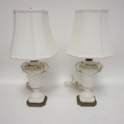 1076	PAIR OF PORDELAIN LAMPS W/APPLIED FLOWERS, LOSSES TO APPLIQUE, TAILOR MADE CLOTH SHADES, 18 IN HIGH
