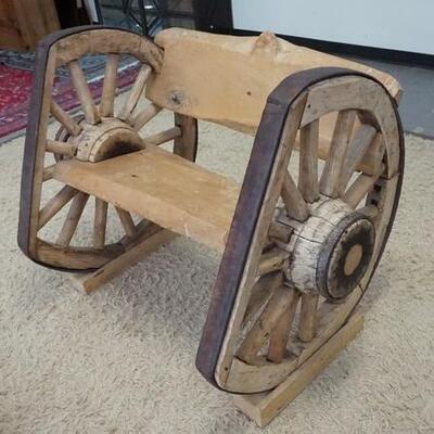 1065	UNUSUAL WAGON WHEEL BENCH SIGNED ALPH OMEGA, 48 IN WIDE X 37 IN DEEP
