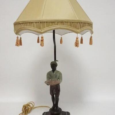 1072	METAL BLACKAMOOR LAMP, HAS CLOTH SHADE W/FRINGE, MOUNTED ON A WOODEN BASE, 29 IN HIGH
