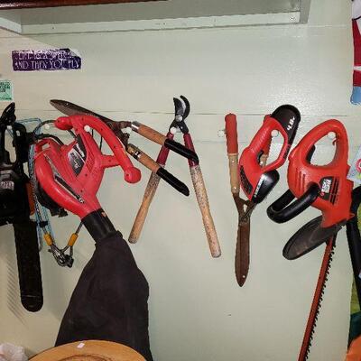 Garden Tools & A Electric Chain Saw.3 Boxes Slate Tile Below.