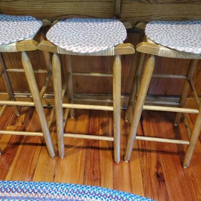 Set of 3 matching oak barstools with thatched seat. Chairs are 31