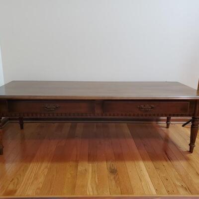 https://ctbids.com/#!/individualEstateSales/316/10496 
Solid coffee table has side by side drawers and has a split on surface. Table...