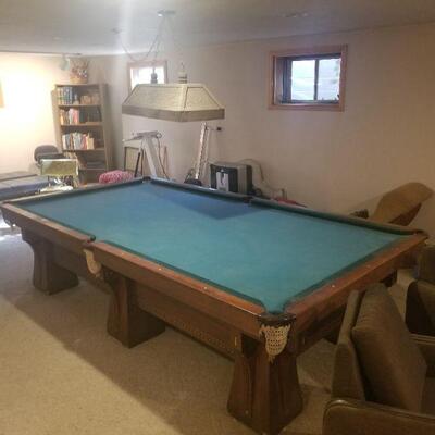 9 ft. Brunswick pool table. Beautifully inlaid. Comes with all accessories.