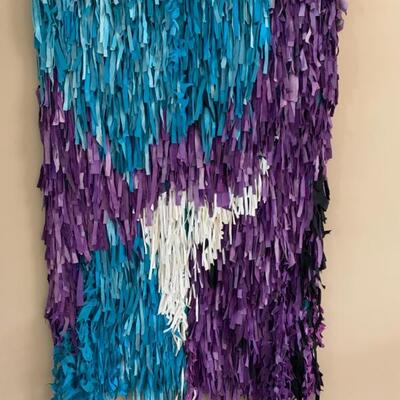 textile and suede wall hanging