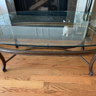 Glass topped coffee table, oval