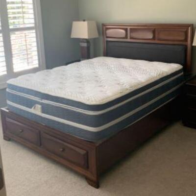 This queen size bed is made from beautiful hardwood and features a tapered design in the headboard with an inset leather accent. The foot...