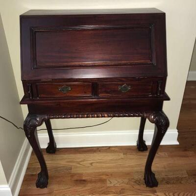 Beautiful secretary desk in a mahogany finish. Desk front flips down to reveal multiple slots for mail, office supplies etc. Desk is in...