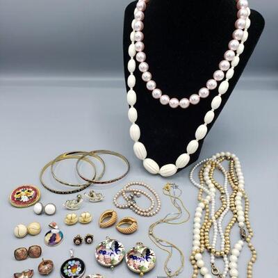Includes bracelets, pendants, cufflinks, necklaces and earrings. Brands include Biagi. Longest necklace measures 18