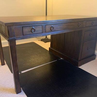 This pedestal desk with inlaid slate tile features identical top drawers on both sides and a set of shelves on one side and drawers on...