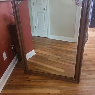 Wood framed mirror. https://ctbids.com/#!/individualEstateSales/316/10666