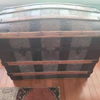 Antique Trunk in ok condition. Outside is still beautiful and mostly unscathed. Measures 30