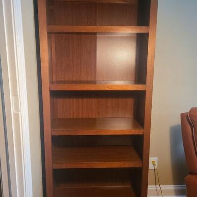 Bookcase has five shelves that are not adjustable. Bookcase is in good condition and measures 31