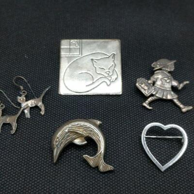 Quirky Silver jewelry 
https://ctbids.com/#!/individualEstateSales/316/10666