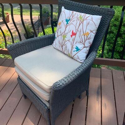 This is a wicker woven patio chair with cushions. There is also a pull out foot stool that slides under the chair as well. 21x27x35â€...