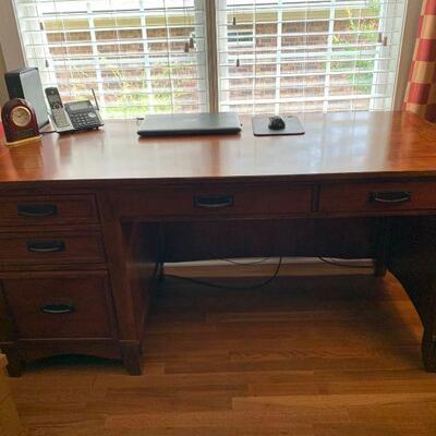 This is a solid desk that has 5 drawers, 2 have dividers. The desk is sturdy and does have some scratches on it. Desk only, measures...
