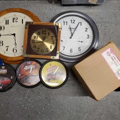 
#5150 â€¢ 6 Wall Clocks, 3 Baby Moon Hib Caps, Ford Emblem