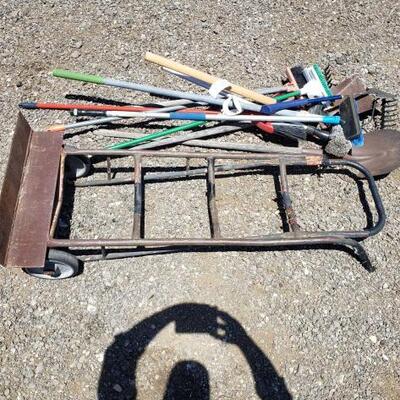 
#60014 â€¢ Hatchet, Brooms, Rakes, Brooms, Shovels, And A Dollie