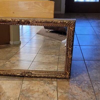 large mirror with beautiful carved wooden frame