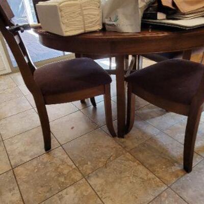 Round wood dining chair and 4 wood padded chairs