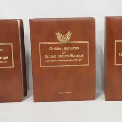 1026	LOT OF THREE GOLDEN REPLICAS OF THE UNITED STATES STAMP ALBUMS. ALBUMS CONTAIN FIRST DAY COVERS W/ GOLDEN REPLICA STAMPS ALONG W/...