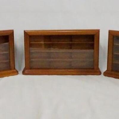 1103	LOT OF THREE THOMAS PACCONI 1900-2000 CLASSICS DISPLAY CASES FOR MODEL CARS. EACH CASE MEASURES; 9 IN X 14 3/4 IN, 2 1/2 IN DEEP. 
