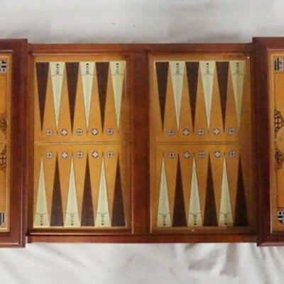 1282	EXCALIBER BACKGAMMON SET W/ PIECES FROM THE FRANKLIN MINT. PIECES ARE DATED 1986.  26 IN X 14 3/4 IN. 4 1/2 IN H 
