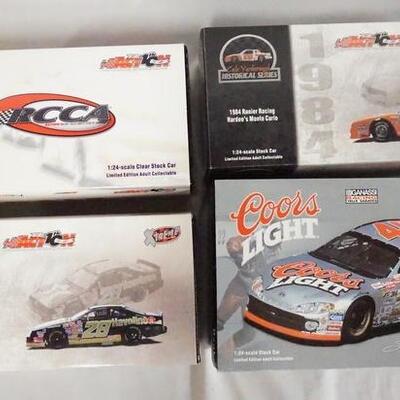 1046	LOT OF FOUR ACTION COLLECTABLES NASCAR 1:24 SCALE MODEL CARS. INCLUDING ONE MOUNTED ON A BASE WITH ORIGINAL BOXES.
