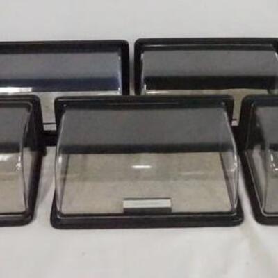1102	LOT OF SEVEN DISPLAY CASES FOR MODEL CARS. EACH DISPLAY CASE HAS A PLAQUE W/ THE NAME OF A SPECIFIC CAR. LOT INCLUDES CASES FOR;...