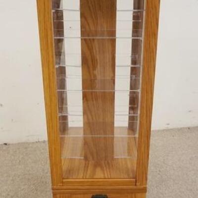 1123	OAK FLOOR/COUNTER TOP REVOLVING DISPLAY CABINET W/TAG THOMAS CLASSICS, 41 IN HIGH X 12 IN X 12 IN

