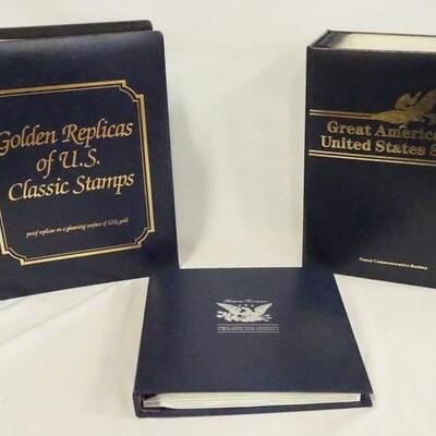 1029	LOT OF 3 GOLDEN/SILVER REPLICA STAMP ALBUMS. LOT INCLUDES BICENTENIAL STAMP ALBUM W/ SILVER REPLICAS, & TWO GOLDEN REPLICA STAMP...