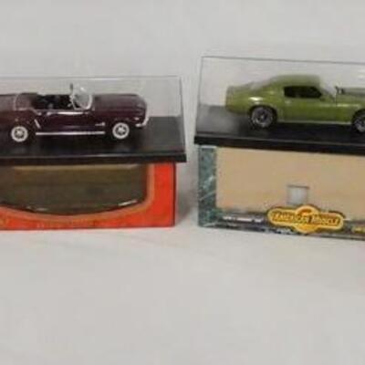 1266	LOT OF FOUR DIE CAST 1:18 SCALE MODEL CARS IN DISPLAY CASES W/ ORIGINAL BOXES. LOT INCLUDES; 1948 TUCKER, A 1964 1/2  MUSTANG, 1970...