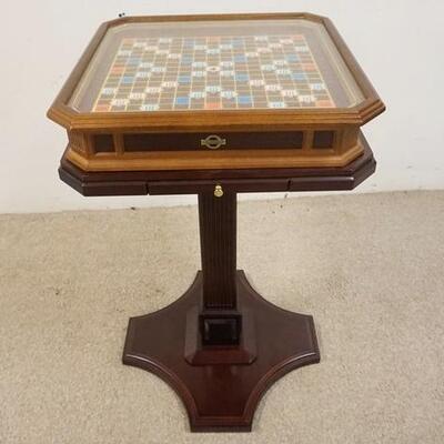 1285	SCRABBLE COLLECTORS EDITION GAME TABLE W/ GOLD TONE PIECES. 19 1/2 IN W, 19 1/2IN DEEP, 32 IN H
