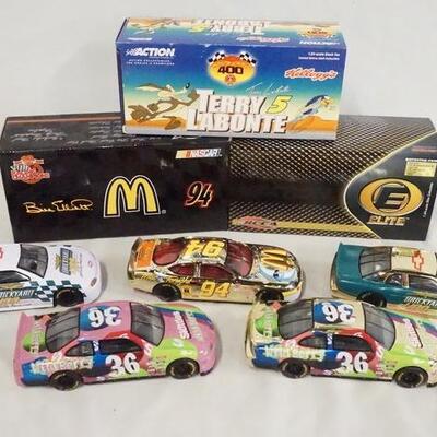 1268	LOT OF EIGHT DIE CAST 1:24 SCALE NASCAR MODEL CARS INCLUDING THREE W/ THE ORIGINAL BOXES. 
