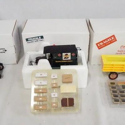1146	LOT OF THREE THREE DIE CAST 1:24 SCALE MODEL TRUCKS FROM THE DANBURY MINT. LOT INCLUDES; 1920S RAILWAY EXPRESS ANGENCY DELIVERY...